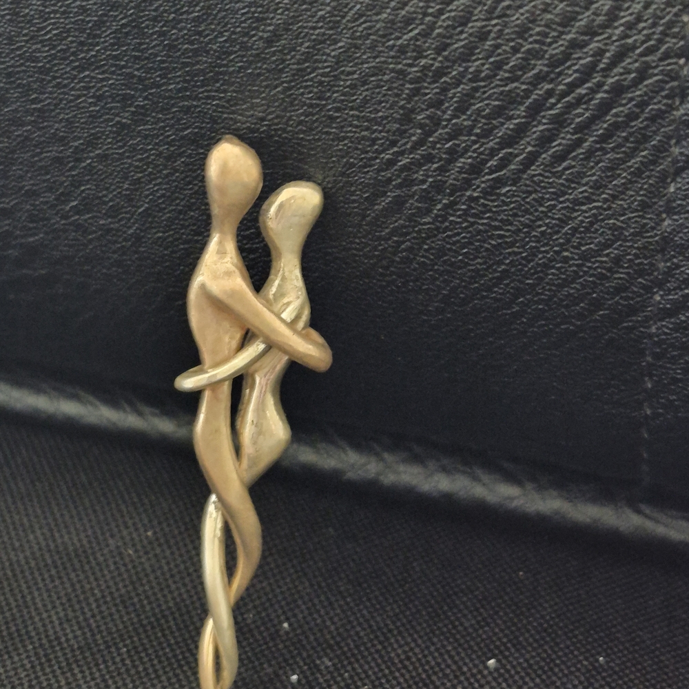 Artisan Man And Woman In Embrace Pendant